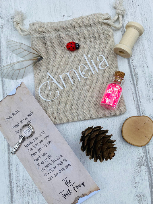 FIRST TOOTH- Tooth Fairy Kit- Girl’s & Boys Personalised Fairy Letter, bag with gifts, wand, fairy dust, fairy wings and more